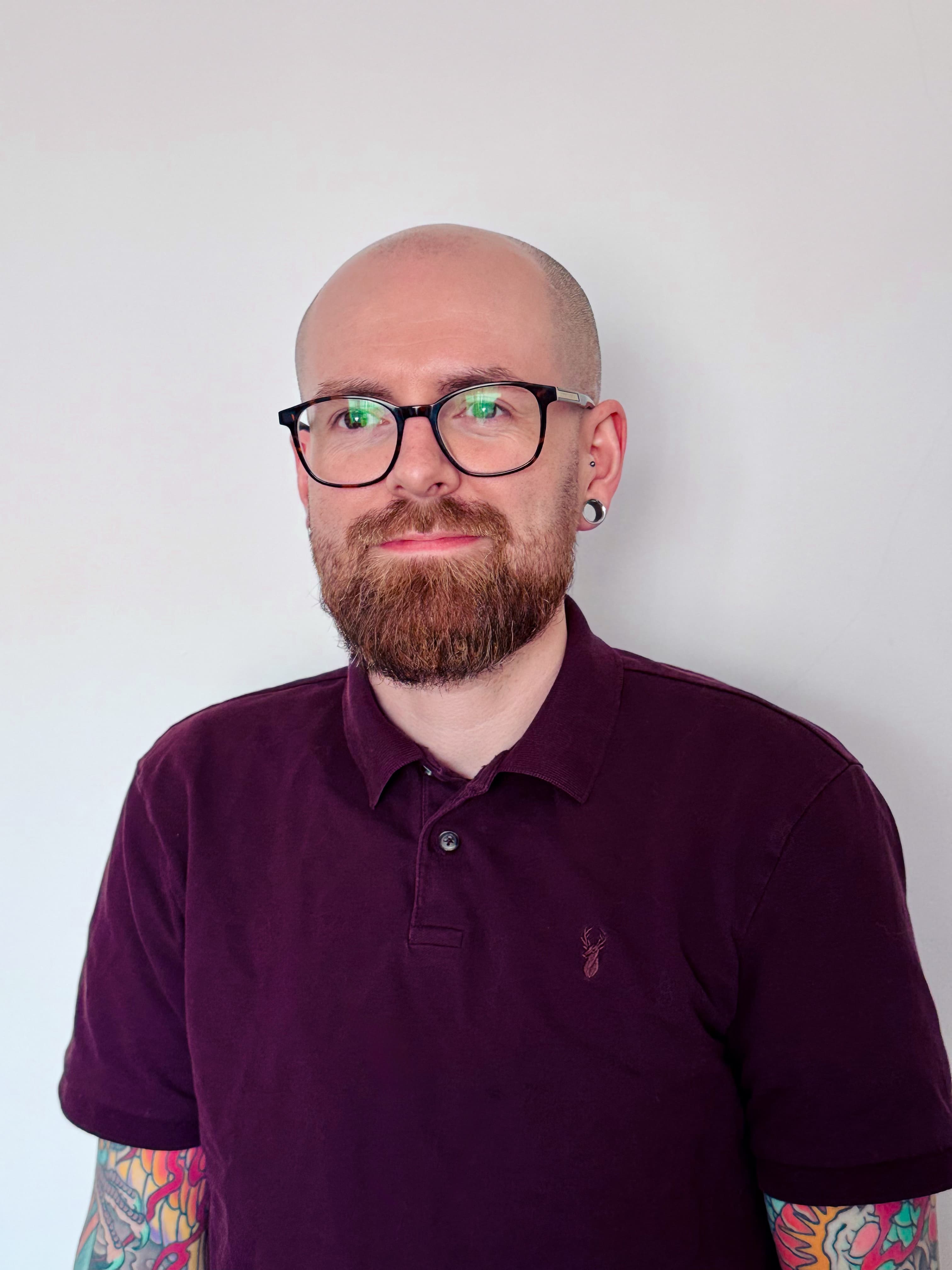 Christopher Dorey at Crispy Labs in a softly lit studio.